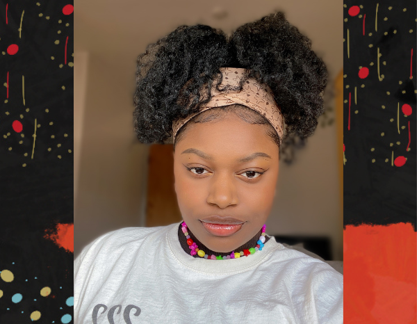 Black woman looking into camera facing front, wearing a white shirt and a brown head scarf. Black woman looking into camera facing front, wearing a white shirt and a brown head scarf.